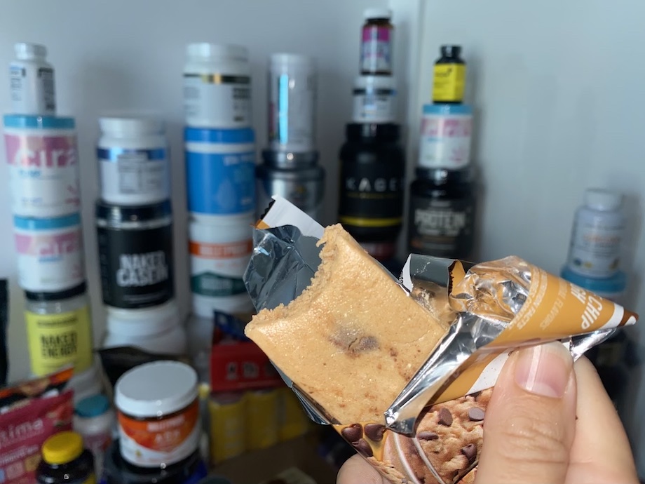 An image of someone holding a Quest Bar, one of the best protein bars