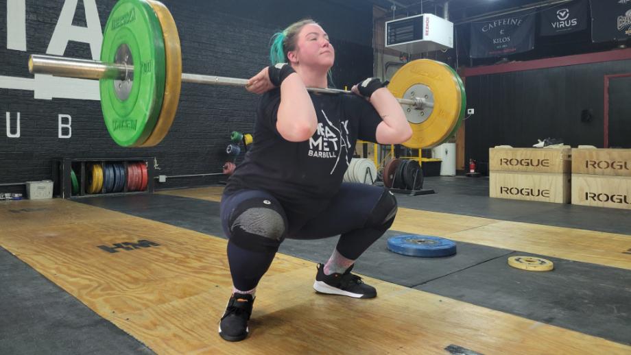 Our tester doing a clean front squat with Reebok Lifter PR 3 weightlifting shoes.