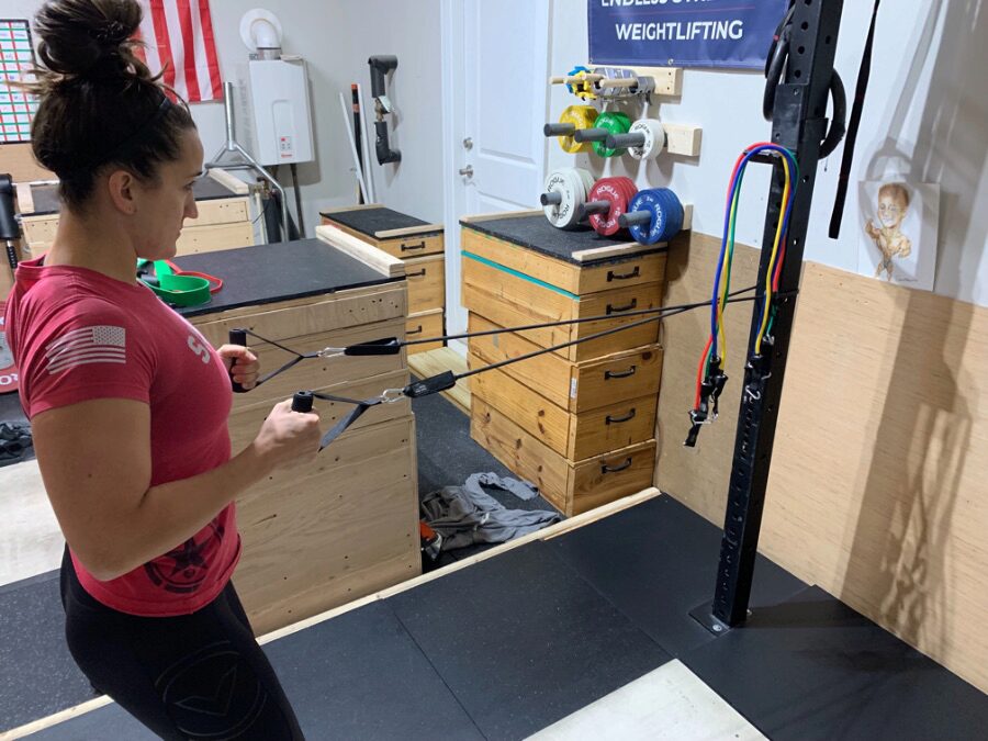 Woman doing rows with the Renoj Resistance Bands