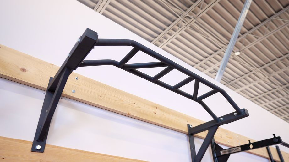 REP multi grip bar on wall