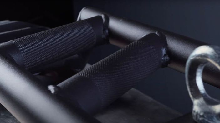 Close up shot of knurling on REP Fitness Cambered Swiss Bar