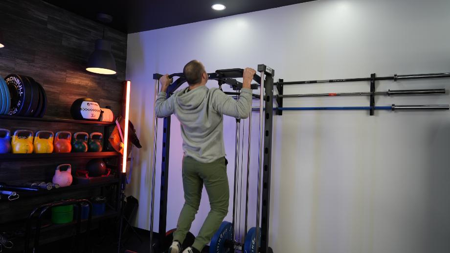 Coop does a pull-up on the RitFit Smith Machine
