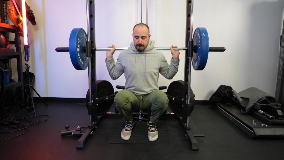 Coop performs a squat on the RitFit Smith Machine.