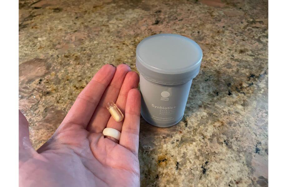 ritual pill in hand synbiotic