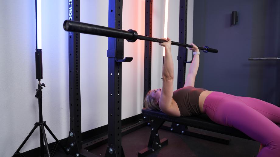 Woman benching using the Rogue HR-2 Half Rack