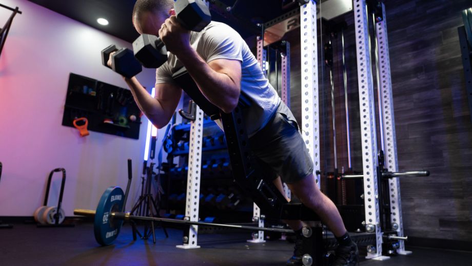 Man performing curls on the Rogue Pritchett Pad