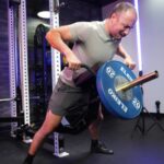 Man performing chest-supported rows on the Rogue Pritchett Pad