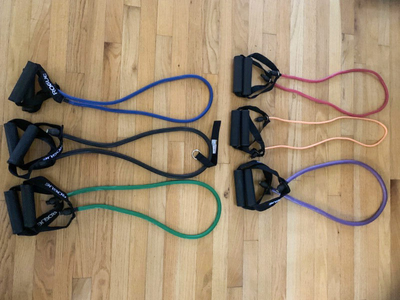 Rogue Tube resistance bands on the hardwood floor