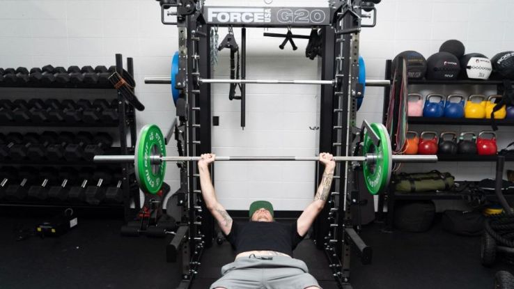 Sam doing bench press on Force USA G20 Trainer