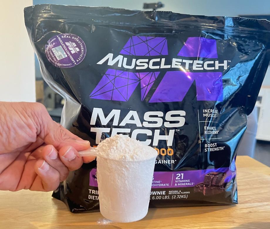 Close up view of a scoop of MuscleTech Mass Gainer