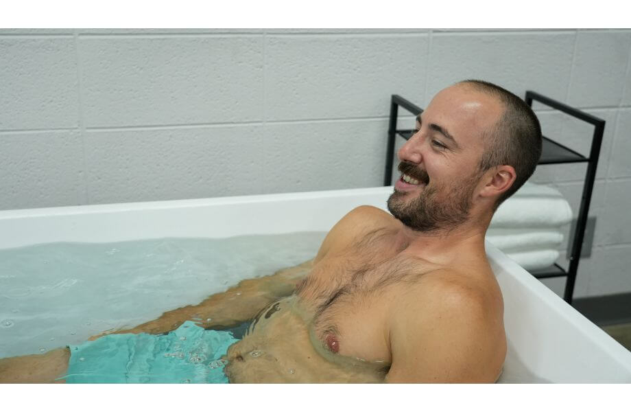 man sitting in cold plunge close up