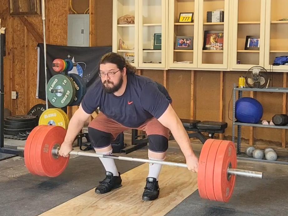 Man performing a snatch grip deadlift