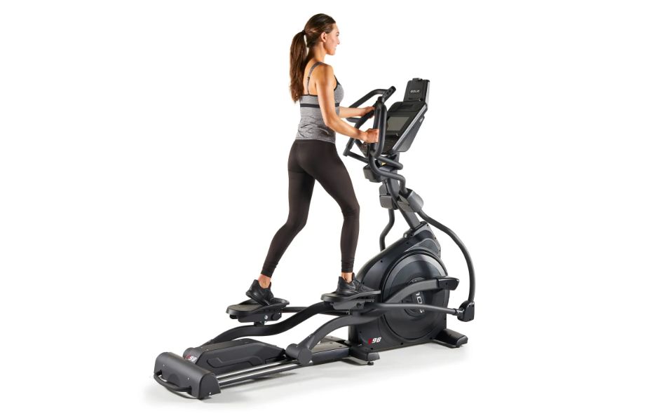 Woman using the Sole E98 Light Commercial Elliptical