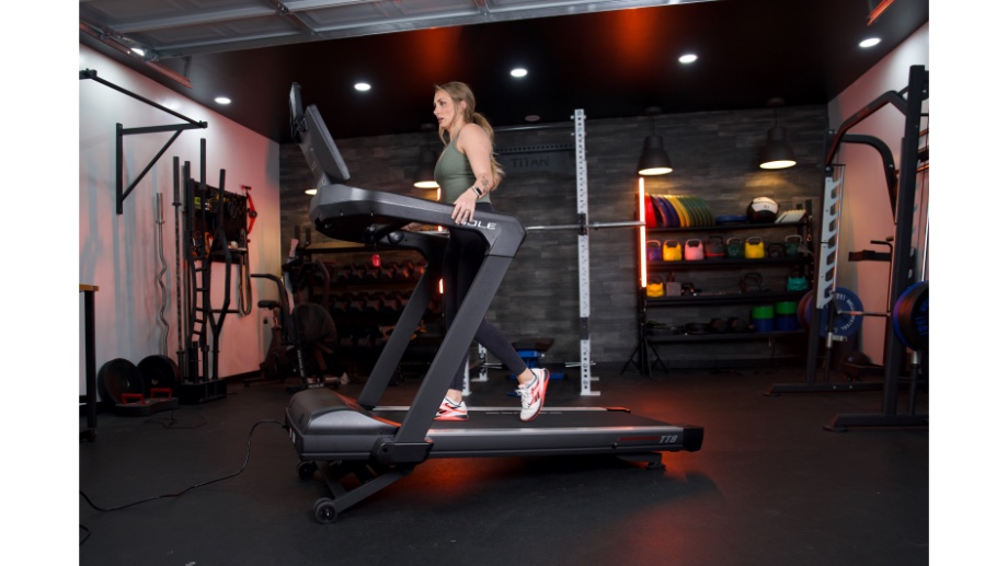 full view of woman walking on sole fitness tt8 treadmill f