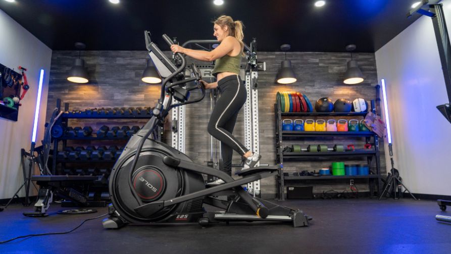 woman riding the sole e25 elliptical