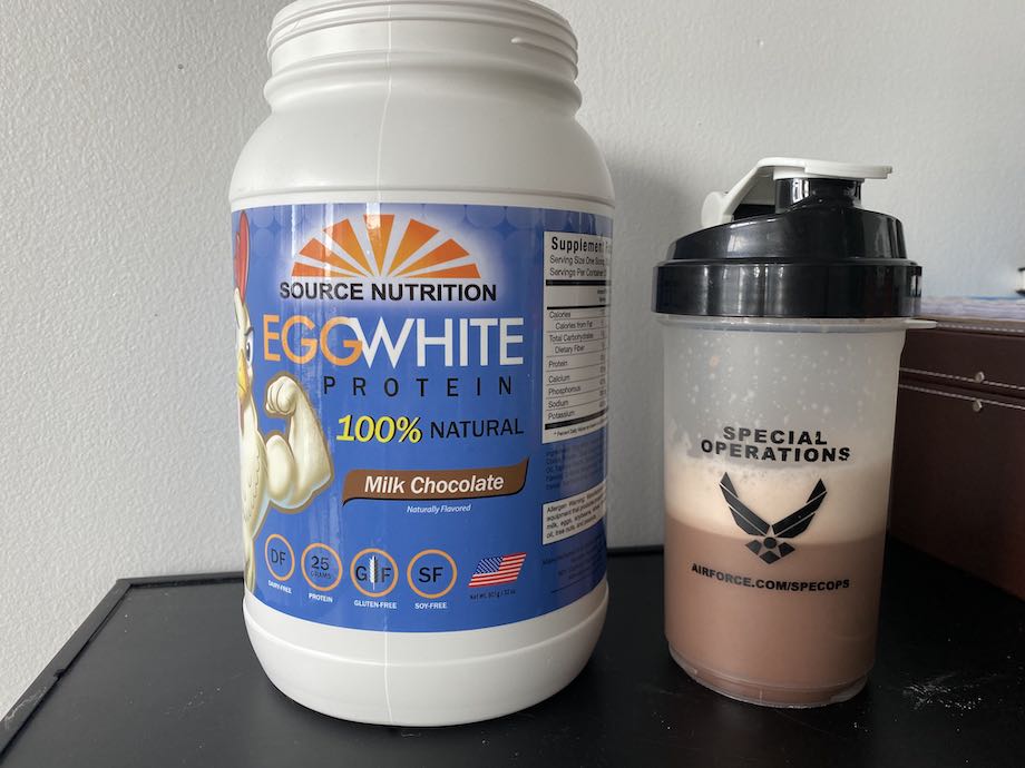 Source Egg White Protein Powder Container And Powder Shaken In Bottle