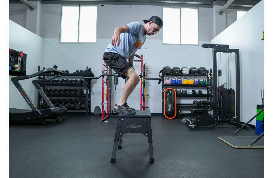 standing on REP Fitness Adjustable Steel Plyo Box