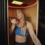 Expert tester Lindsay Scheele, CPT, invites the viewer to step inside for a Sun Home Pod Sauna review.