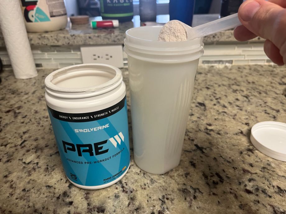 scooping swolverine PRE pre-workout