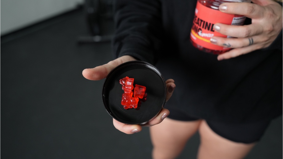 Swoly Creatine Gummies in the container lid