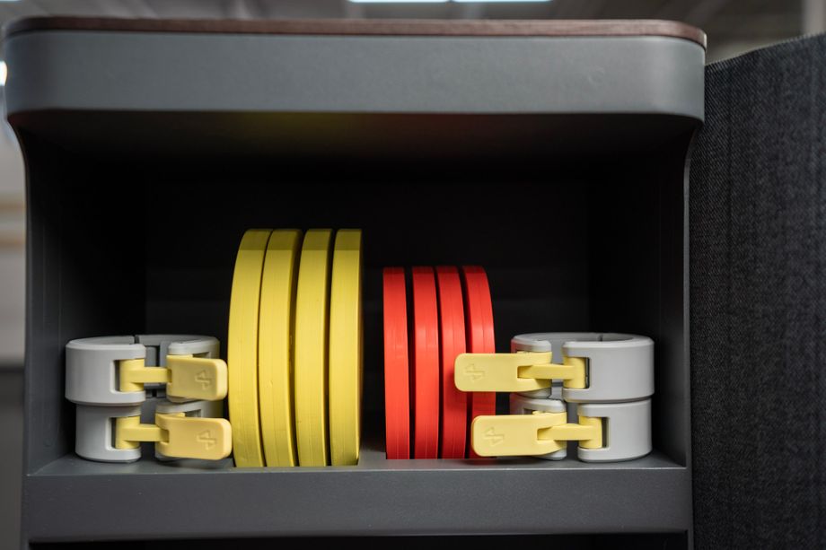 Tempo Move weights and collars inside storage cabinet