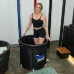 Woman standing inside The Cold Pod tub