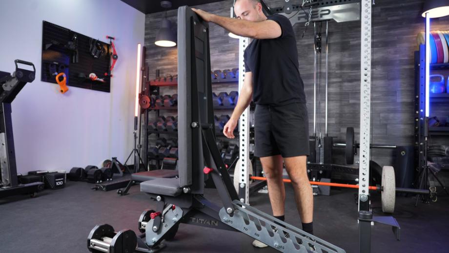 Adjusting the back pad to a vertical position using the TITAN Series Adjustable Bench's ladder system