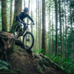 Luke Burgess riding through the forest on a Transition Smuggler