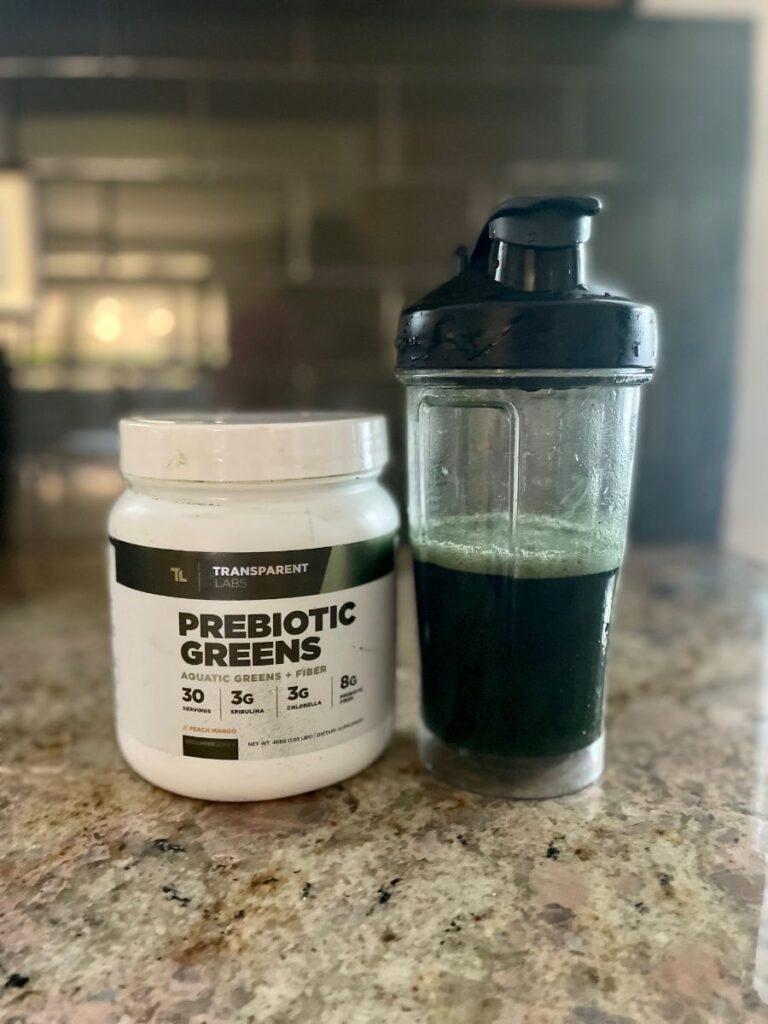 An image of Transparent Labs Prebiotic Greens in a shaker