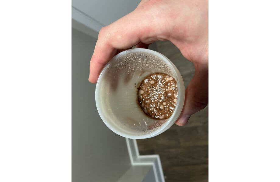 transparent labs protein scoop in hand