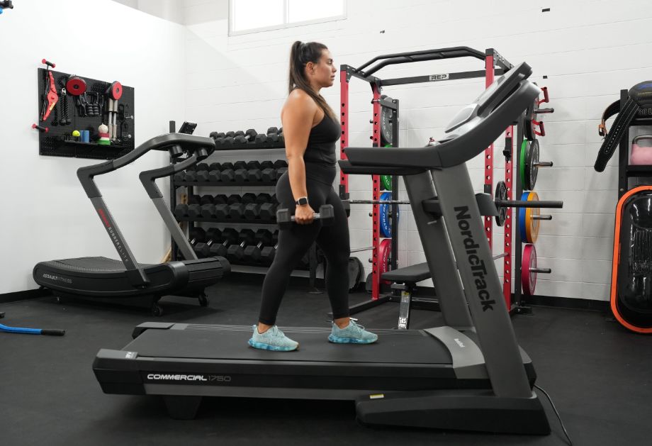 Woman doing a treadmill arm workout