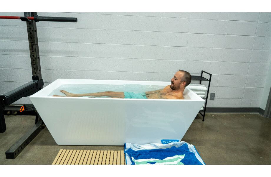 man using cold plunge