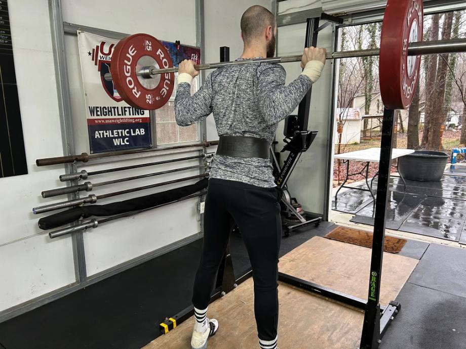 A person using the Eleiko Weightlifting Belt while doing squats.