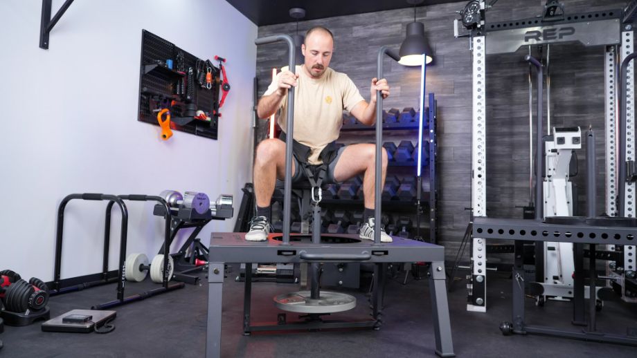 Man using the Titan Fitness SquatMax-MD belt squat
