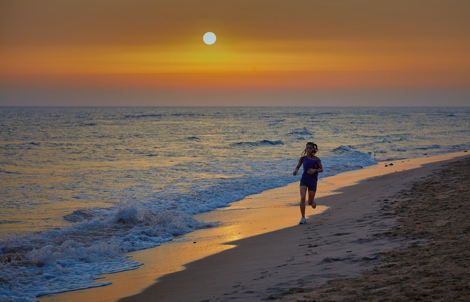 running on the beach at sunrise
