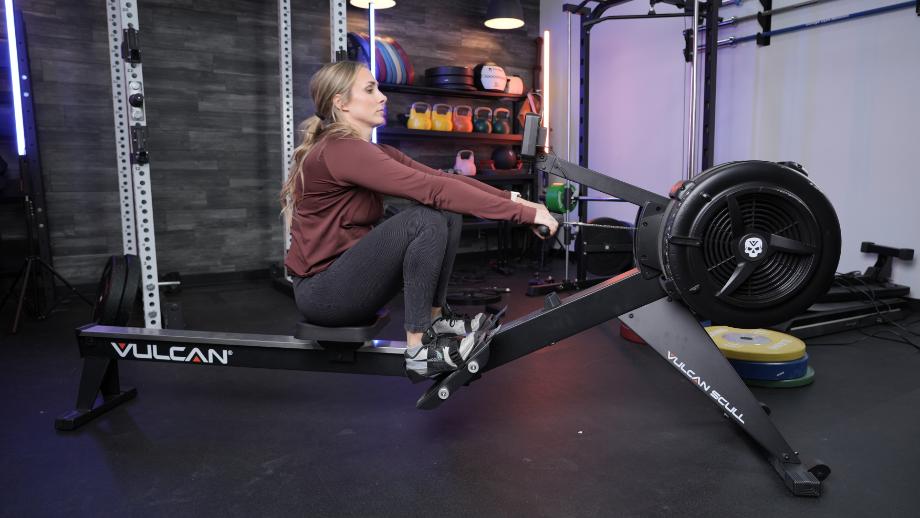 Woman rowing on Vulcan Scull Rower