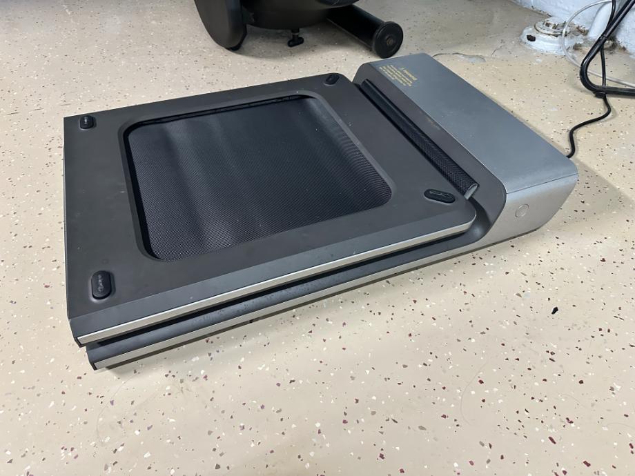 A WalkingPad Treadmill is shown in the folded position