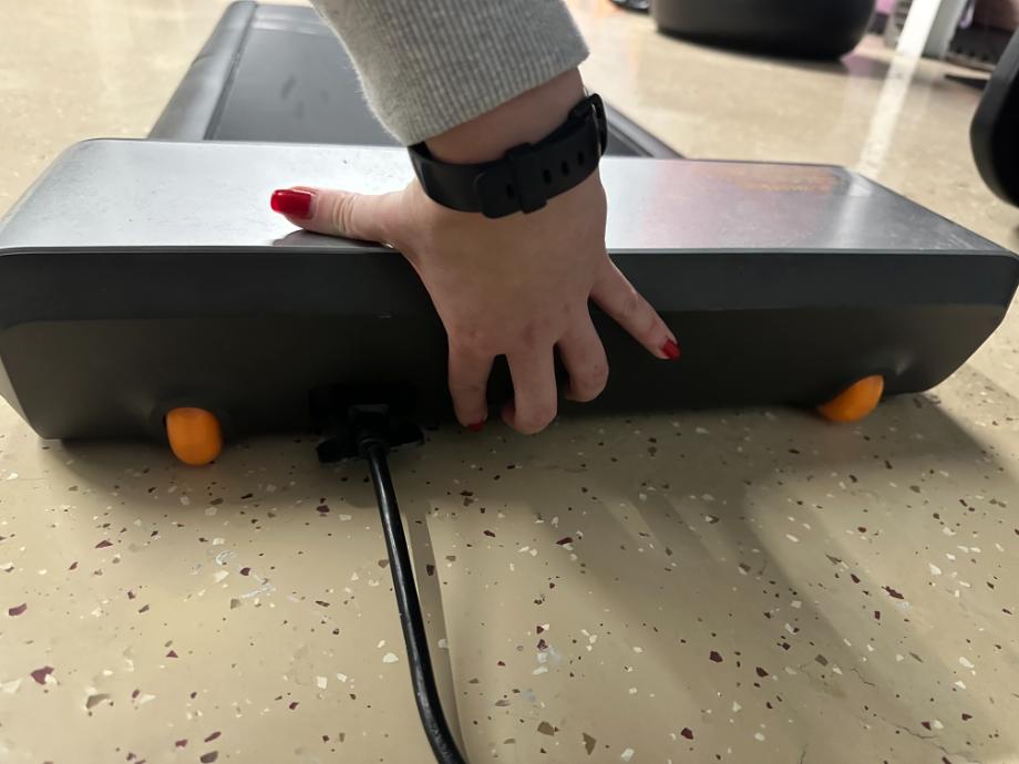 A close-up of the power button on a WalkingPad Foldable Treadmill