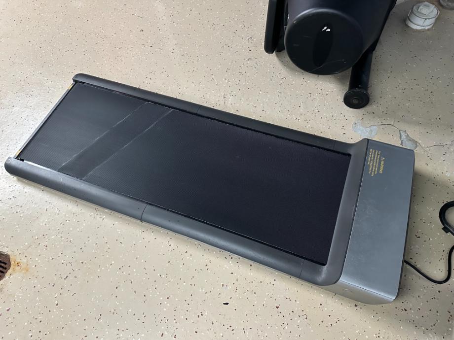 A WalkingPad Treadmill is shown in the unfolded position