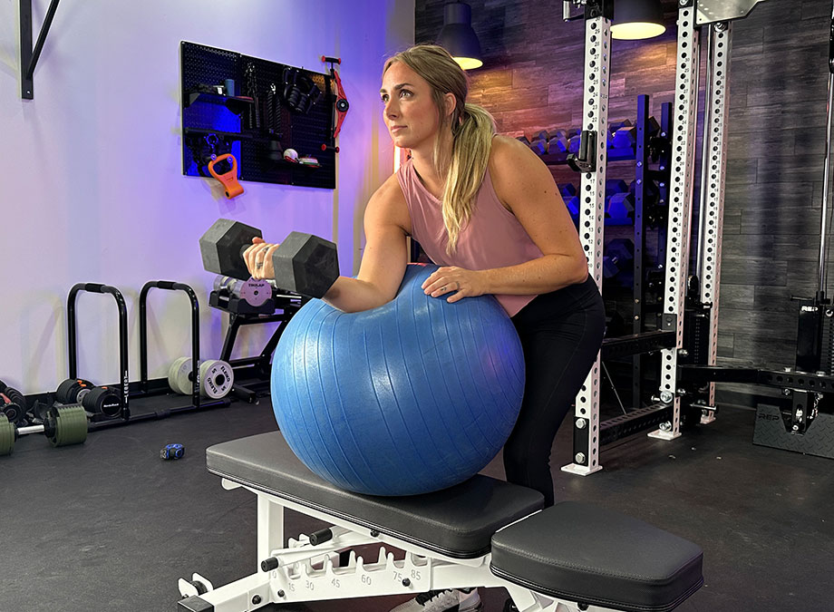 woman-doing-a-stability-ball-preacher-curl