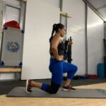 woman doing lunges wearing powerlix knee sleeves