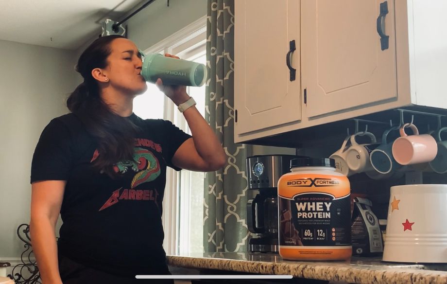 Woman Drinking Body Fortress Protein Powder
