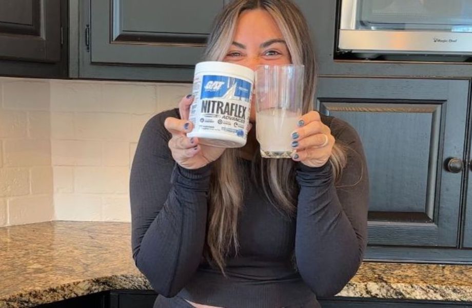 A woman holding Nitraflex Pre-Workout