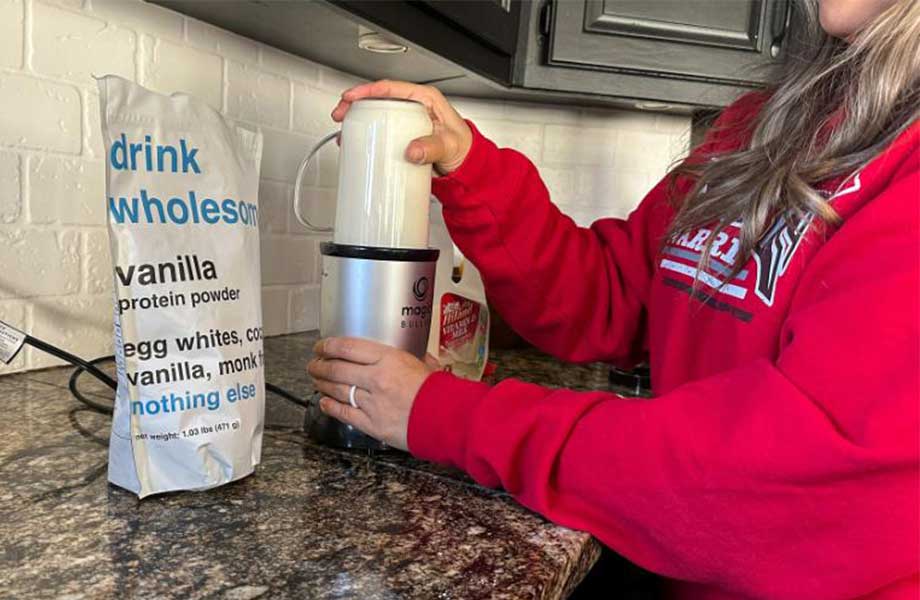 Woman making a Drink Wholesome shake