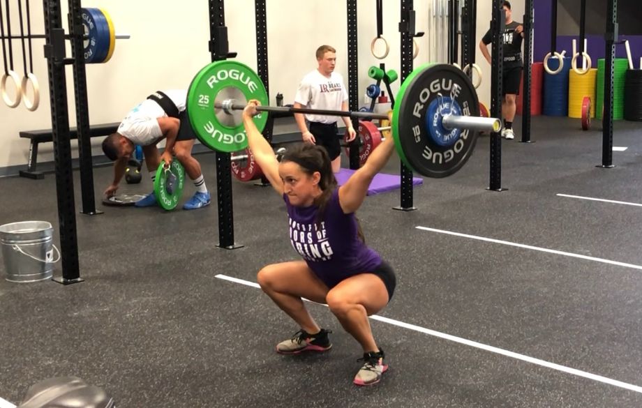 Woman overhead squatting Synergee Regional Bar