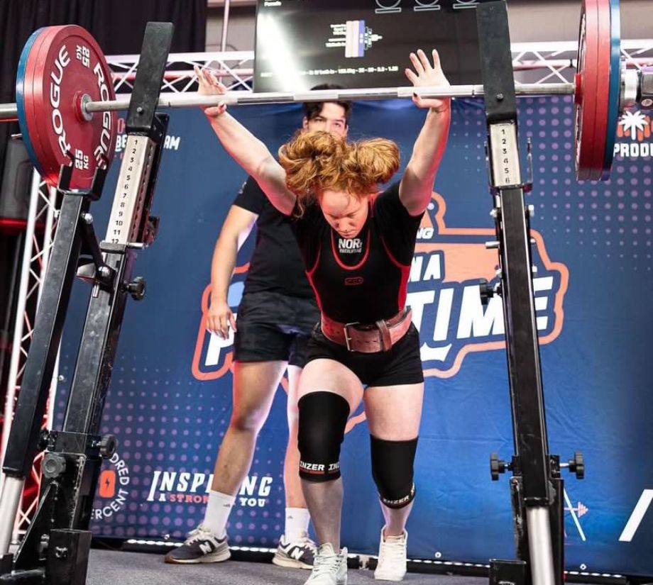 Woman powerlifting on Rogue OPB