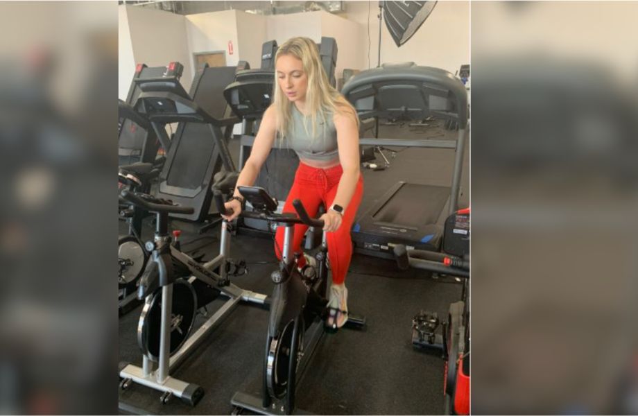 woman riding exercise bike