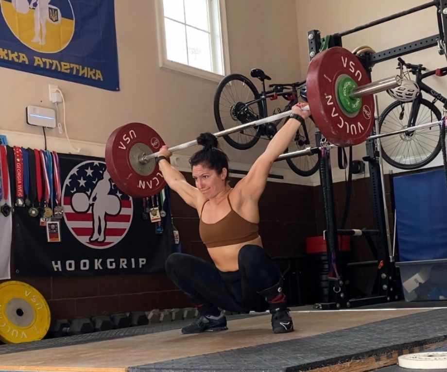Woman snatching Eleiko weightlifting bar