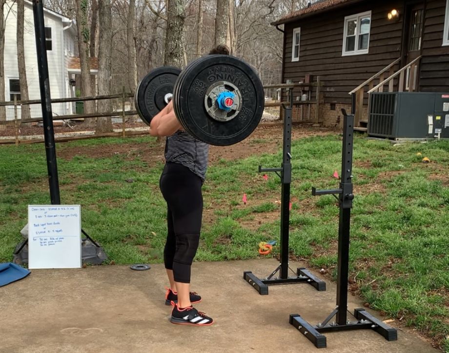 Woman squatting with Get RxD bar
