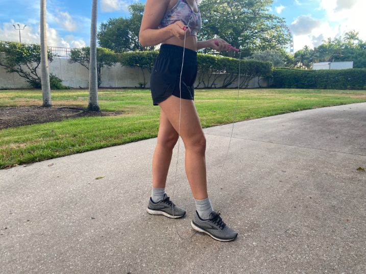 Woman stepping over a jump rope